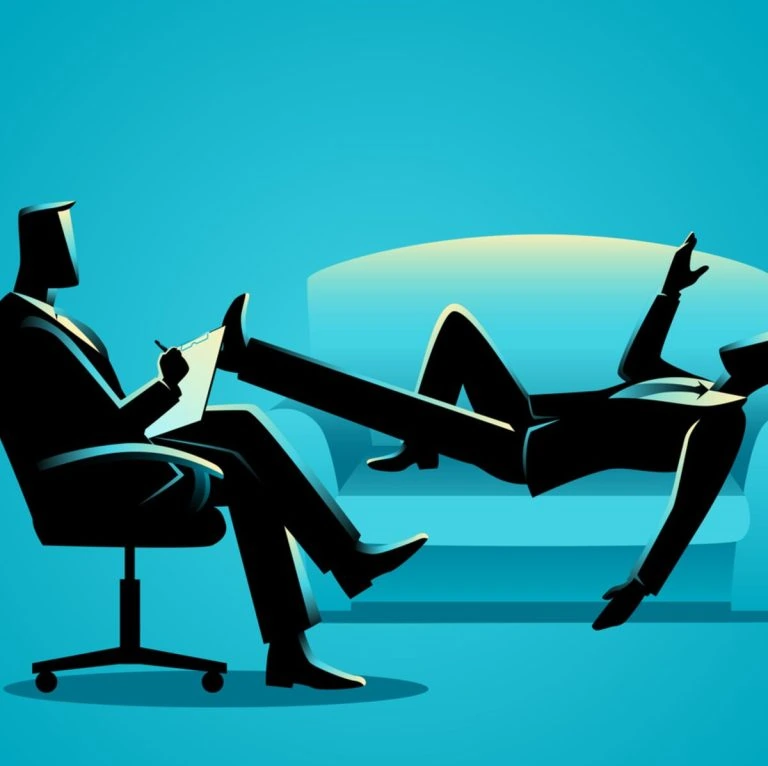 A silhouette of a businessman sitting on a couch with his leg on the floor.